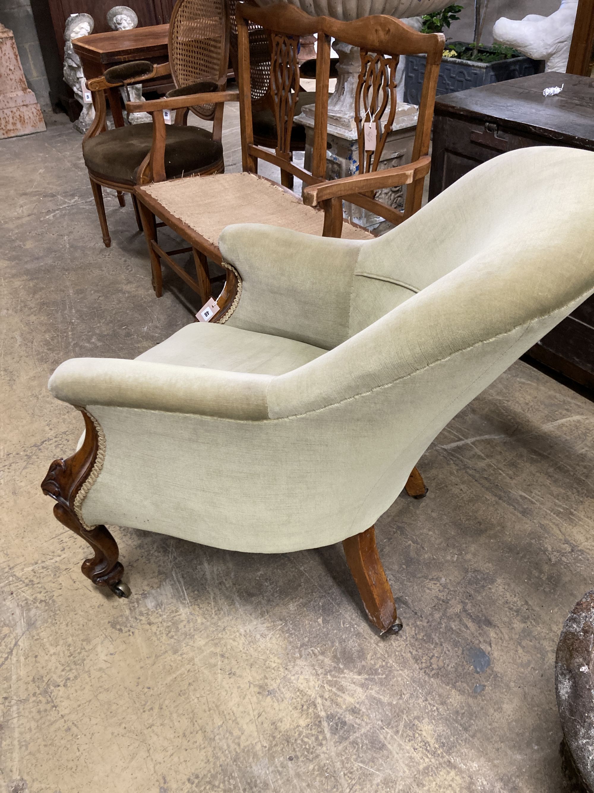 A Victorian walnut spoon back armchair, width 66cm, depth 84cm, height 84cm
